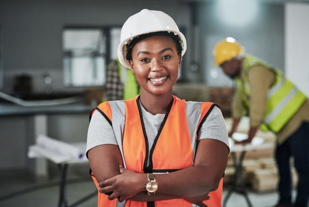 Portrait of a confident young woman working at a construction site