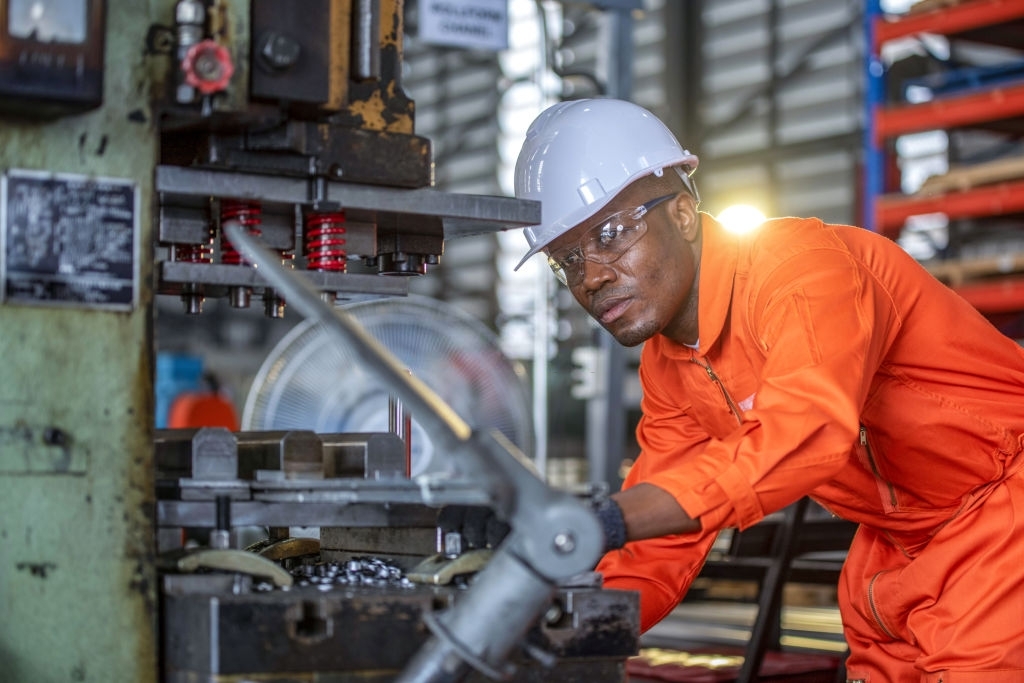 Engineer, male  working in a factory training.