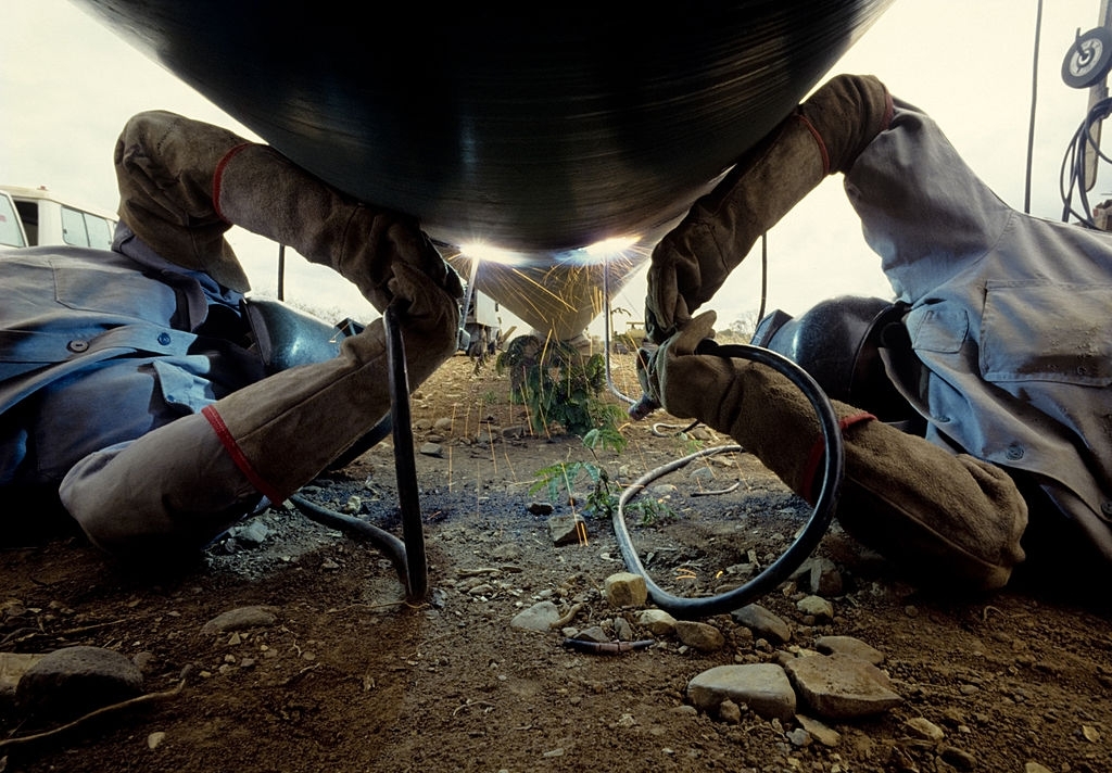 arc welders working in a gas pipeline.